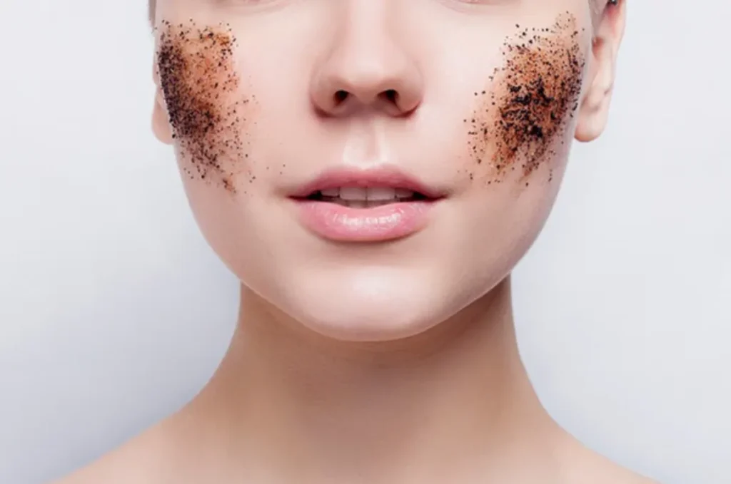 A woman with coffee smeared on her face, looking astonished in a relaxed environment.